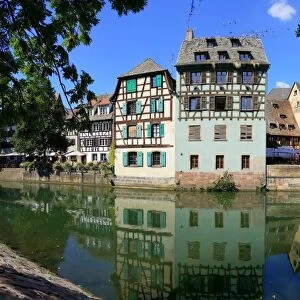 Half-timbered houses reflected in the Ill river, Strasbourg, France