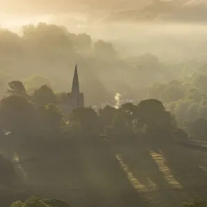 Hathersage church surrounded by the hills of the Peak District at sunrise. UK Hathersage church surrounded by the hills of the Peak District at sunrise. UK