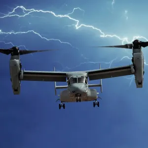 A head-on view of a U. S. Marine Corps Bell/Boeing MV-22 Osprey tilt-rotor aircraft with lightning A head-on view of a U. S. Marine Corps Bell/Boeing MV-22 Osprey tilt-rotor aircraft with lightning