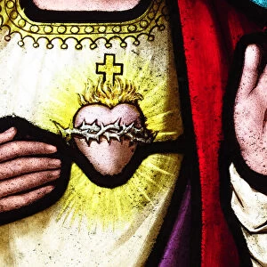 Heart and hands of Jesus Christ on an old stained glass