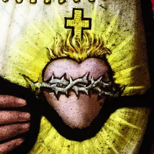 The heart of Jesus Christ on an antique stained glass window The heart of Jesus Christ on an antique stained glass window