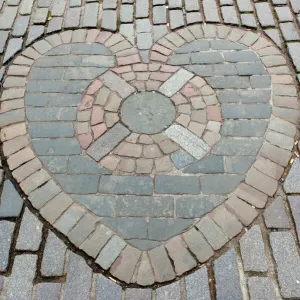 Heart of Midlothian, paving stones mosaic in front of St. Giles Cathedral, High Street, Royal Mile, Edinburgh, Scotland, United Kingdom