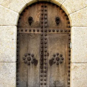 Heavy wooden doors at entrance of building Heavy wooden doors at entrance of building