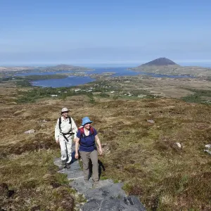 Hikers climbing to Diamond Hill, Connemara National Park, County Galway, Republic of Ireland, Europe Hikers climbing to Diamond Hill, Connemara National Park, County Galway, Republic of Ireland, Europe