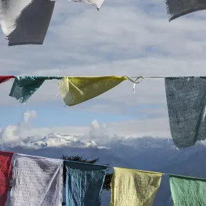 Himalayas seen through prayer flags, Dorcha La Pass, Bhutan Himalayas seen through prayer flags, Dorcha La Pass, Bhutan