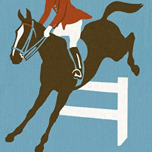 Horse and Rider Jumping Over Fence