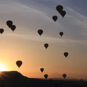 Hot air balloons flying above rock formations, Goreme National Park, Goreme, Cappadocia, Anatolia, Turkey Hot air balloons flying above rock formations, Goreme National Park, Goreme, Cappadocia, Anatolia, Turkey