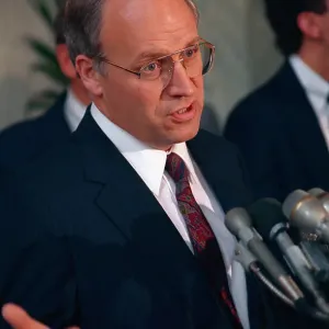 House Panel Official Dick Cheney Gesturing While Speaking to Reporter