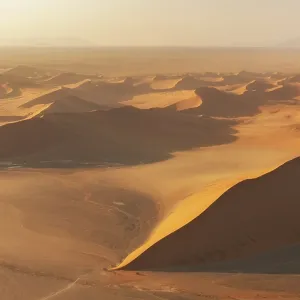 Huge sand dunes in dawn light in the Namib desert near Sossusvlei in Namibia, Africa Huge sand dunes in dawn light in the Namib desert near Sossusvlei in Namibia, Africa