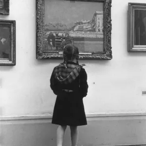 Print of a schoolgirl studying a painting in the Tate Gallery, London Print of a schoolgirl studying a painting in the Tate Gallery, London