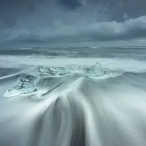 Ice rests on the beach off the inlet to Jokulsarlon Glacial Lagoon in southwest Iceland Ice rests on the beach off the inlet to Jokulsarlon Glacial Lagoon in southwest Iceland