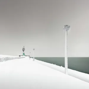Iced lighthouse in the harbour of Sassnitz, Ruegen, Germany Iced lighthouse in the harbour of Sassnitz, Ruegen, Germany
