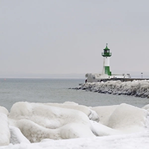 Iced wharf and a lighthouse in the port of Sassnitz on Ruegen Island, Mecklenburg-Western Pomerania, Germany, Europe