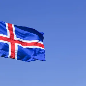 Icelandic national flag blowing in the wind, Iceland, Europe Icelandic national flag blowing in the wind, Iceland, Europe