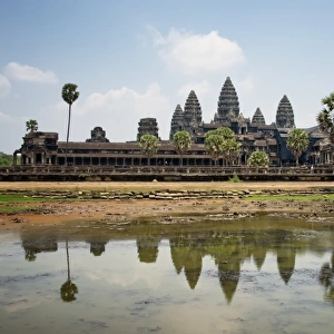 Iconic Angkor Wat Reflecting in Lake; Cambodia, Siem Reap, Angkor Wat Temple