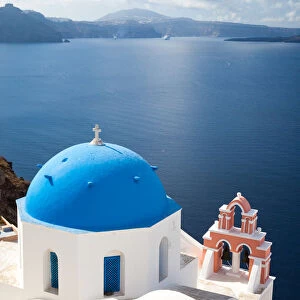 Iconic blue domed church in Oia Santorini Greece