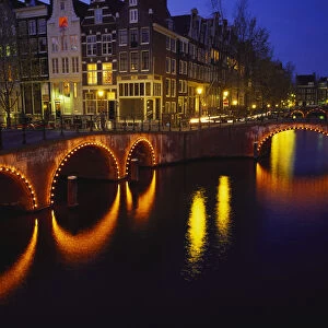 Illuminated Bridges Reflected in the Canals at Night, Keizersgracht, Amsterdam