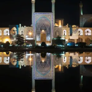 Imam mosque reflected in a pool by night, Isfahan, Iran Imam mosque reflected in a pool by night, Isfahan, Iran