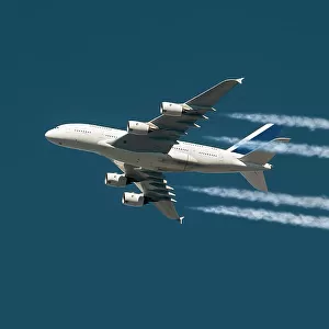 Inflight view of an Airbus A380-841 wide body airliner with contrails