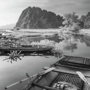 An infrared image of traditional bamboo boats on the waterways of Ninh Binh in Vietnam An infrared image of traditional bamboo boats on the waterways of Ninh Binh in Vietnam