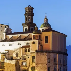 Italy, Campania, Atrani, Townhouses and tower at dusk