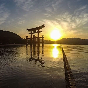 Japanese torii on the island of MiyaJima at sunset
