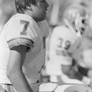 John Elway Sitting on Sidelines in Uniform John Elway Sitting on Sidelines in Uniform