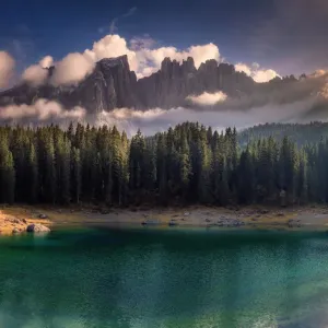 Lake Carezza and dramatic sky Lake Carezza and dramatic sky