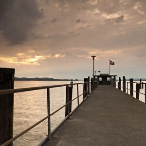 Lake Constance and approaching thunder clouds in the evening, pier in Mannenbach, Switzerland, Europe