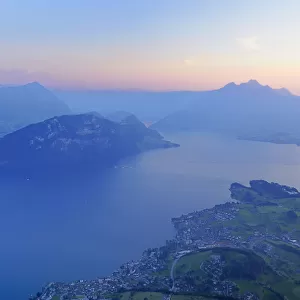 Lake Lucerne with the village of Weggis, in the distance, Pilatus Mountain, Lucerne, Switzerland, Europe