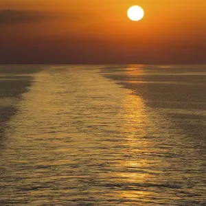 Landscape of a large boat wake on the ocean at sunset - Venice Euorpe Landscape of a large boat wake on the ocean at sunset - Venice Euorpe
