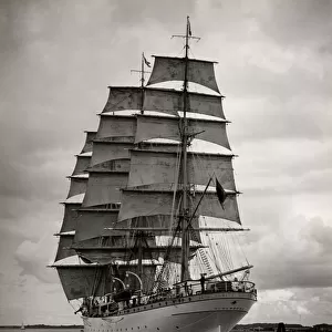 Large vintage ship under full sail
