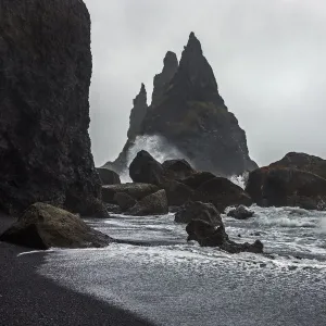 Lava rocks and rock needles at the black lava beach Reynisfjara, near Vik, South Iceland