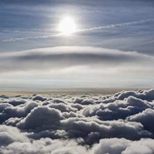 Lenticular cloud, Cumulus lenticularis, above the top layer of clouds, North Rhine-Westphalia, Germany