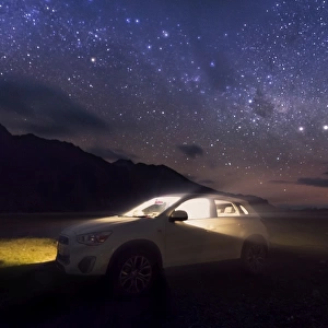 a lid up car in a starry sky