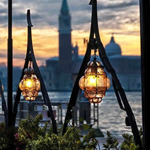 Lighted lamps in the Venice sunset