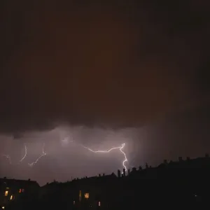 Lightning over a residential area in Leipzig, Saxony, Germany, Europe Lightning over a residential area in Leipzig, Saxony, Germany, Europe