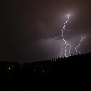 Lightning over a residential area in Leipzig, Saxony, Germany, Europe Lightning over a residential area in Leipzig, Saxony, Germany, Europe