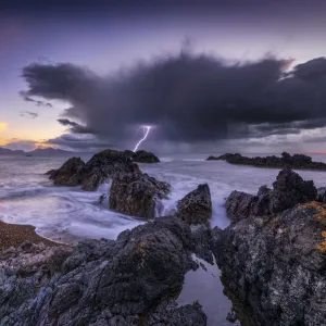 Llanddwyn Island beach at sunset with a lightning strike, Bangor, Caernarfon, , Anglesey