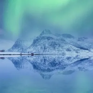 Lofoten Islands, Norway. Aurora Borealis over the lake and landscape mirroring Lofoten Islands, Norway. Aurora Borealis over the lake and landscape mirroring