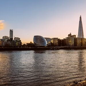 London skyline at sunset with Shard skyscraper and London City Hall, United Kingdom