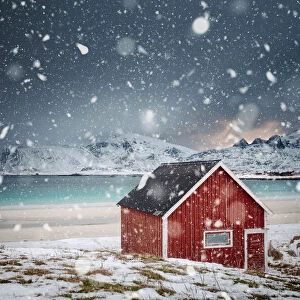 Lonely red house under the snow, Norway
