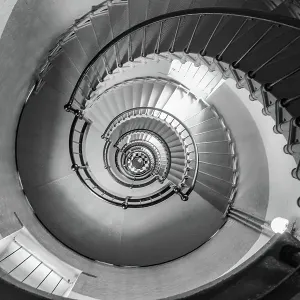 Looking Downward an Indoor Spiral Staircase Looking Downward an Indoor Spiral Staircase