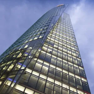 Low angle view of glass skyscraper Low angle view of glass skyscraper
