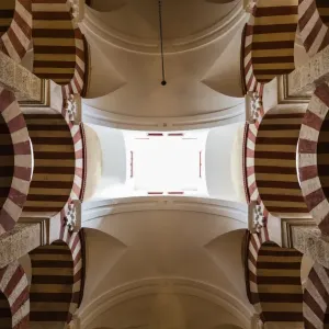 Low angle view of ornate arches and skylights in mosque, Cordoba, Andalusia, Spain Low angle view of ornate arches and skylights in mosque, Cordoba, Andalusia, Spain