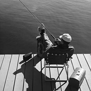 Man fishing from dock