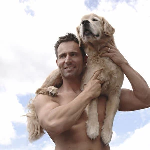 Man with Golden Retriever on his shoulder