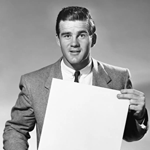 Man holding blank paper