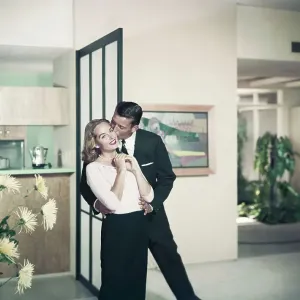 Man kissing woman, smiling