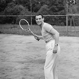 Man playing tennis, (B&W)